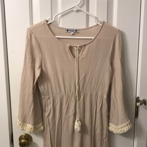 Maxi dress. Light gray to cream color with tassel trim to both arms.